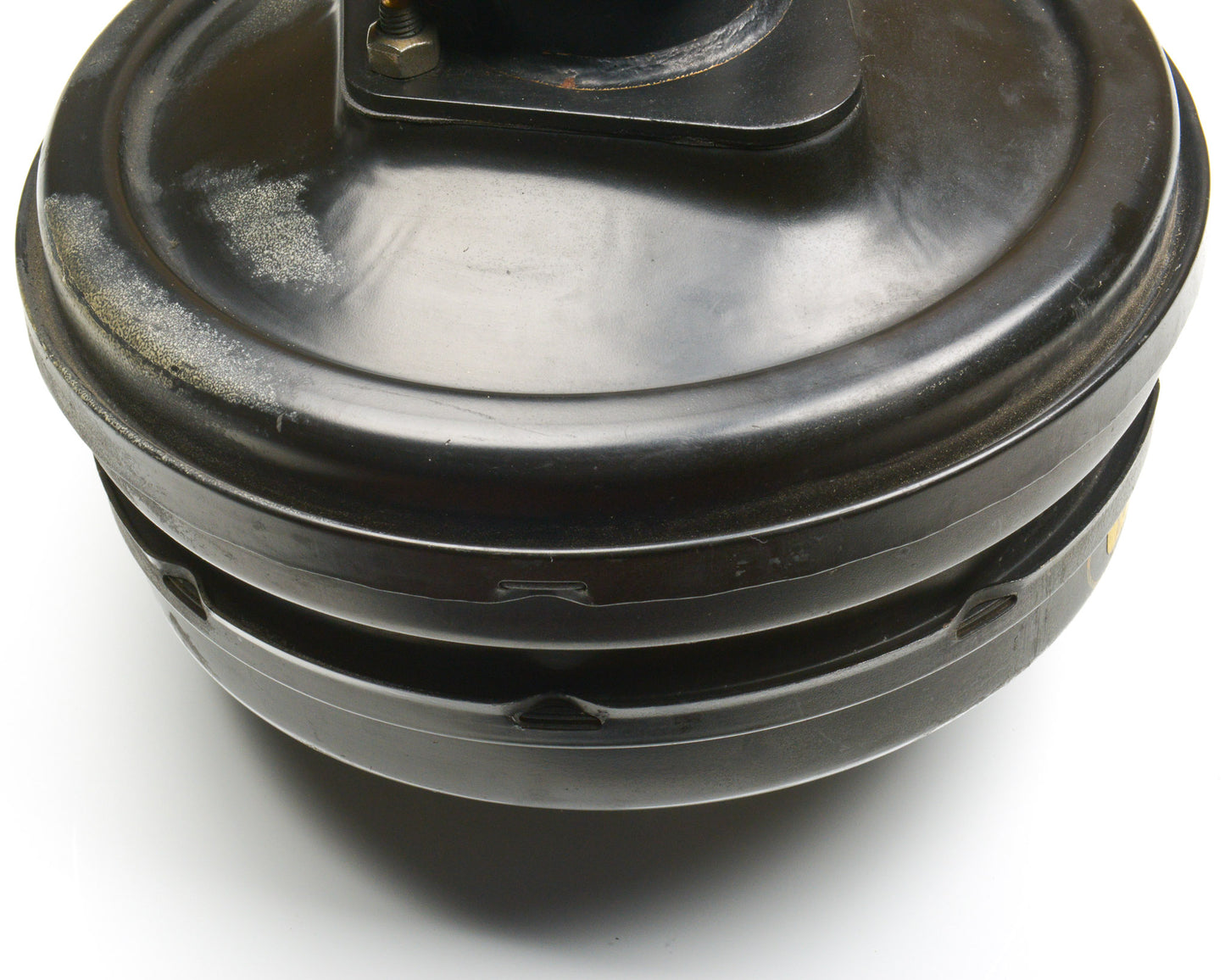 Close-up of a black mechanical component on a white background
