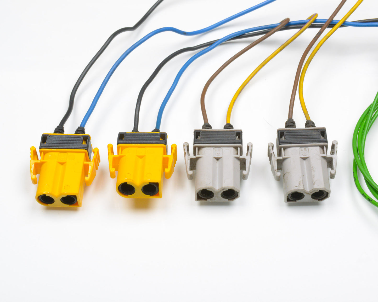Set of electrical connectors with colored wires on a white background