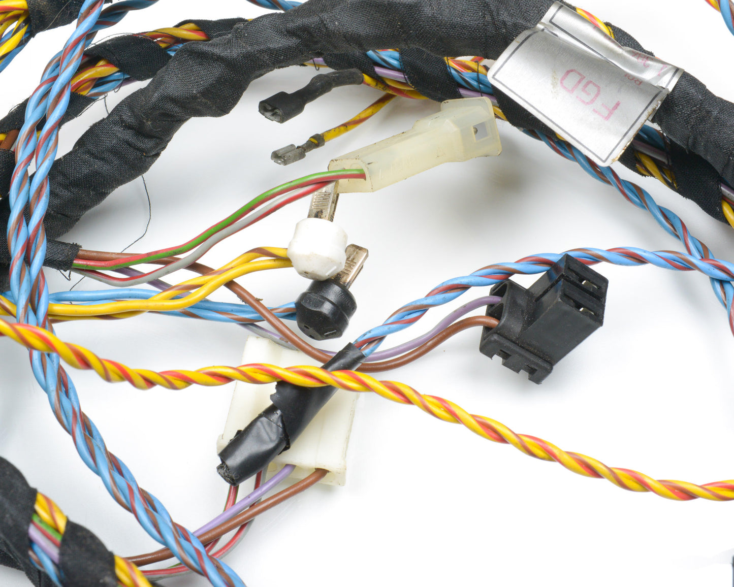 Electrical wiring harness with connectors on a white background