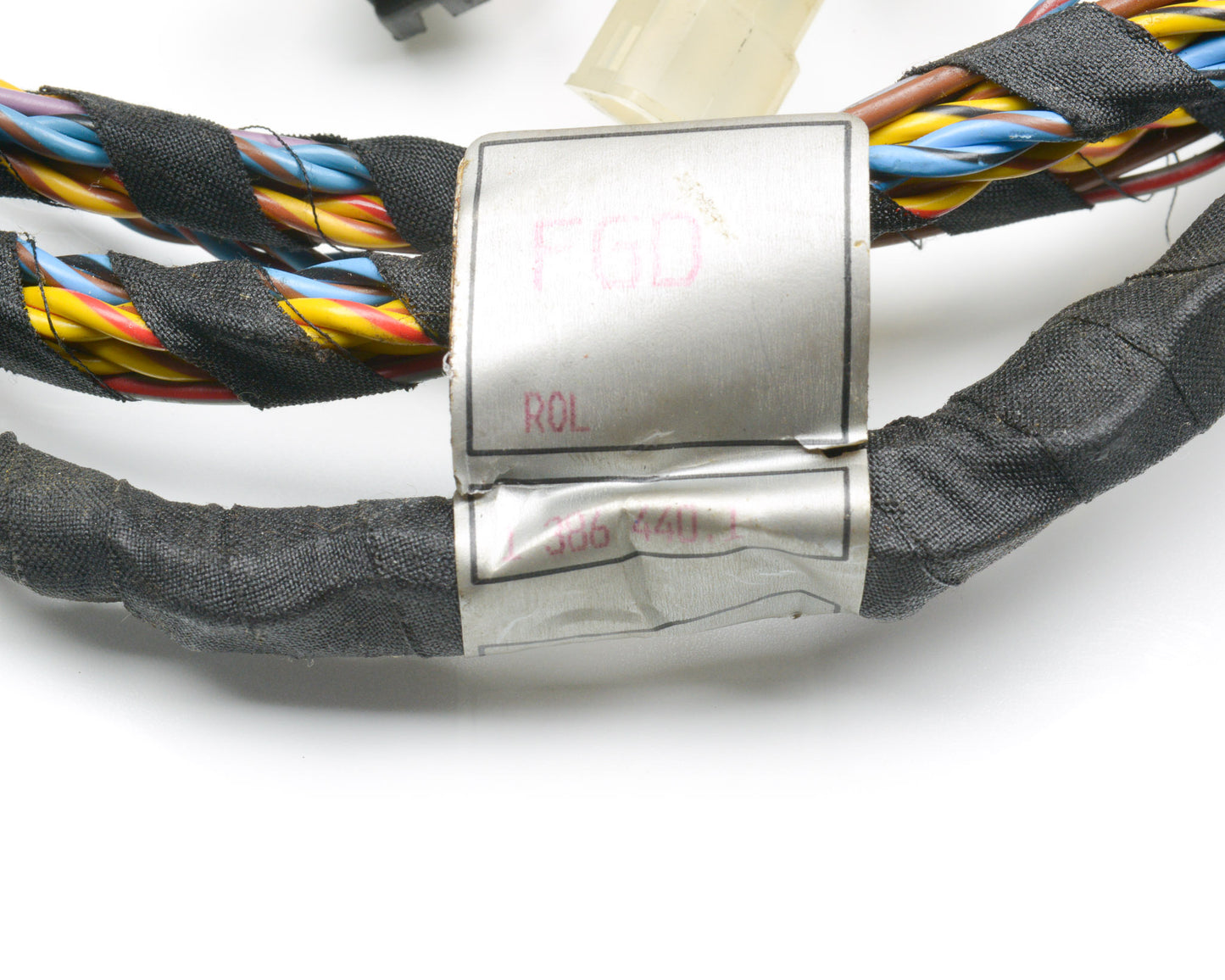 Colorful braided belt with a silver buckle on a white background