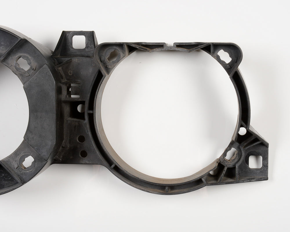 BMW E30 Driver Side Ellipsoid Headlight Bracket 63121385601