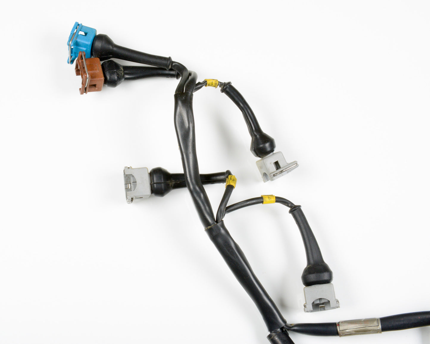 A black automotive wiring harness with various multi-pin connector plugs in blue, brown, silver, and white, shown on a clean white background.