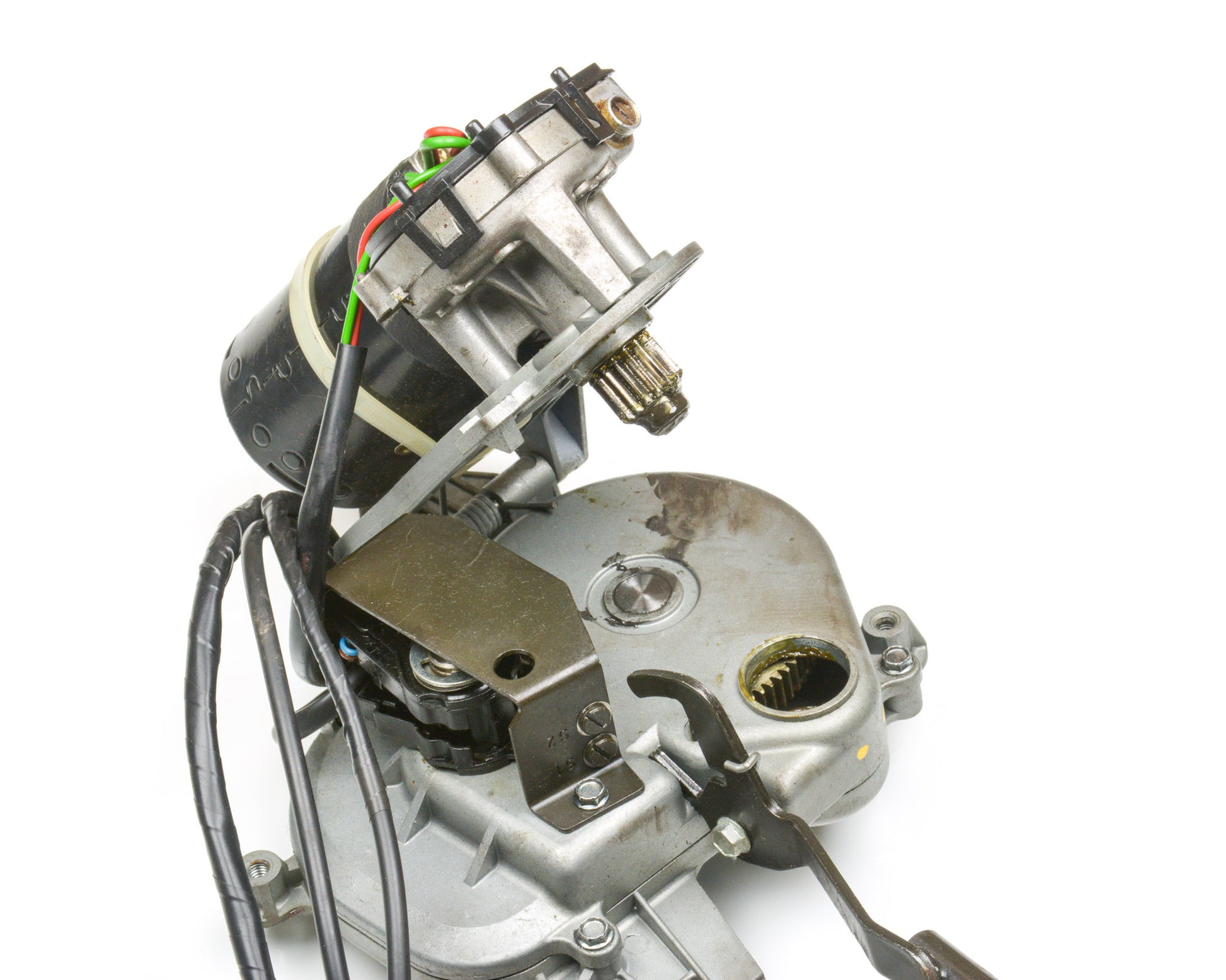 Close-up of a mechanical component with wiring on a white background