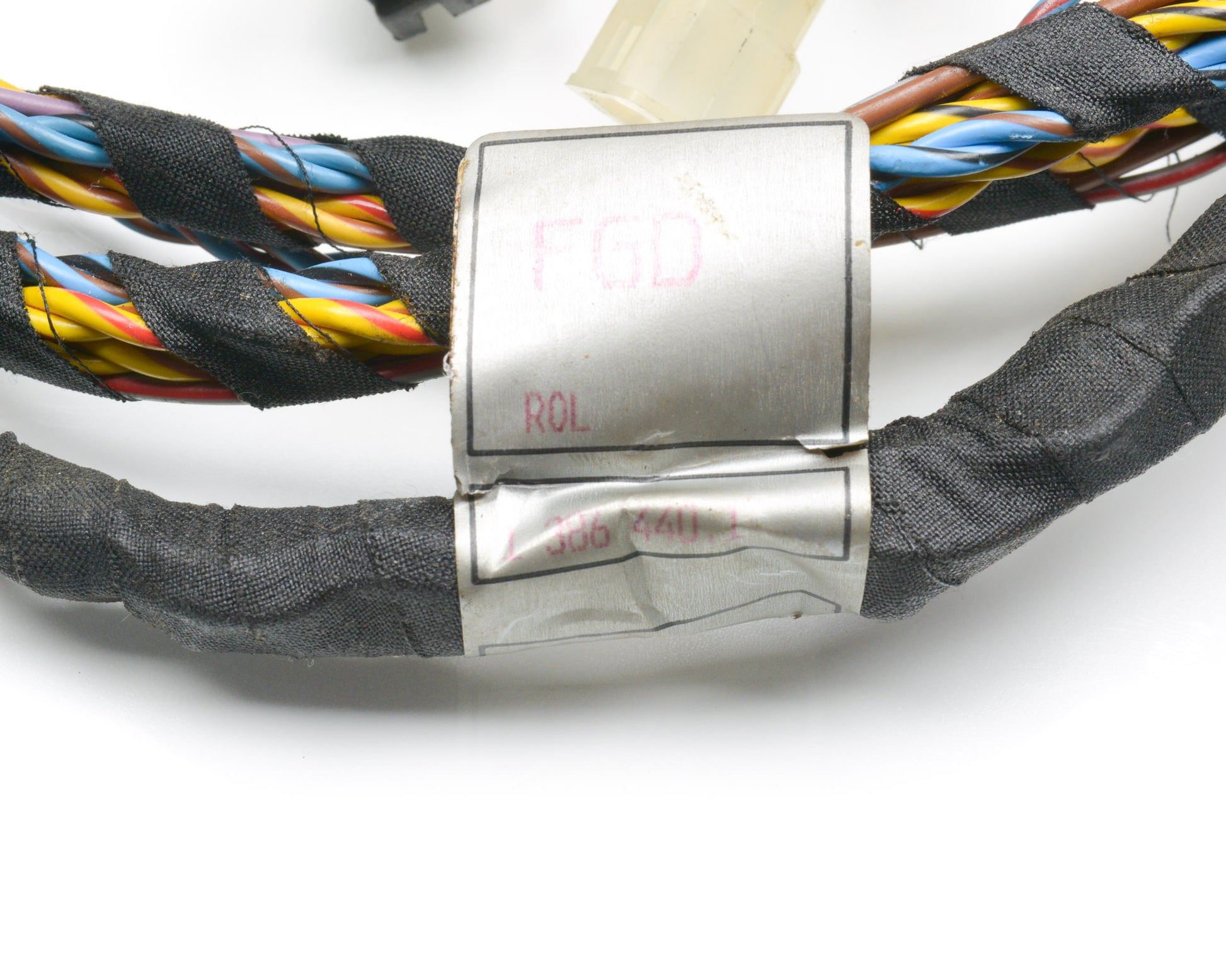 Colorful braided belt with a silver buckle on a white background