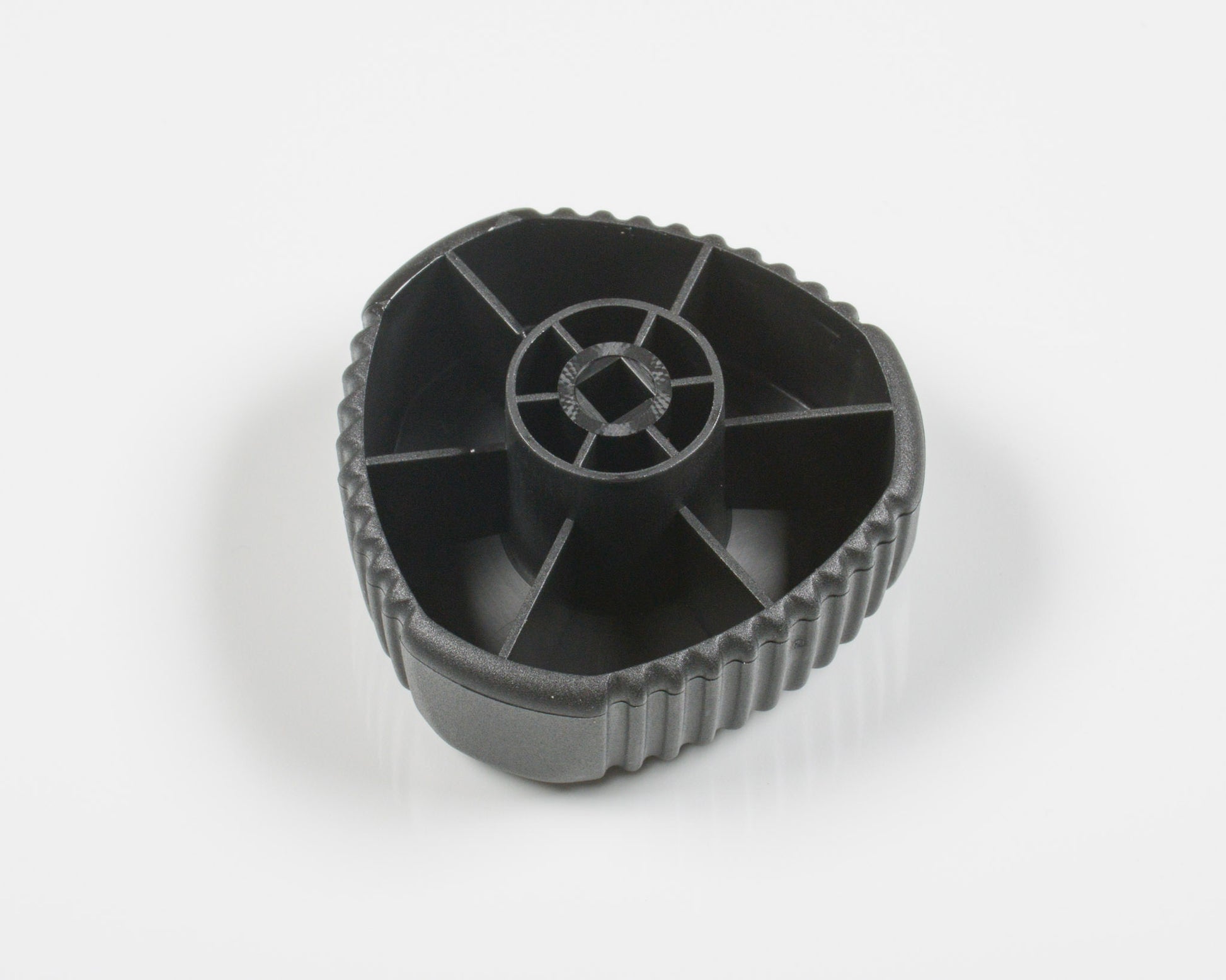 Black plastic gear on a white background